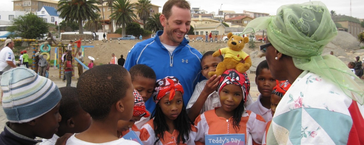 Peter Liptak shares books with Namibian schools at the end of a 250km desert race