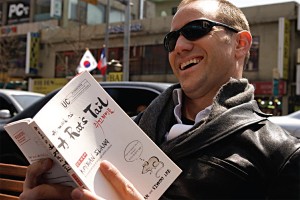 Peter Liptak in Itaewon reading "As much as a Rat's Tail"